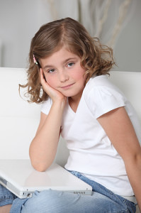 http://www.dreamstime.com/stock-photography-little-girl-sat-laptop-image25357672